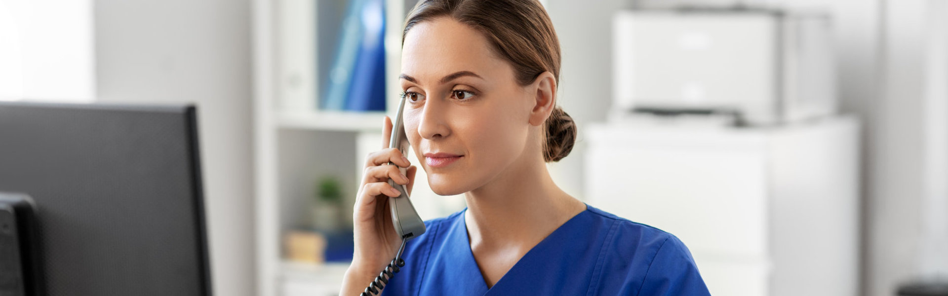 a health professional woman using a phone